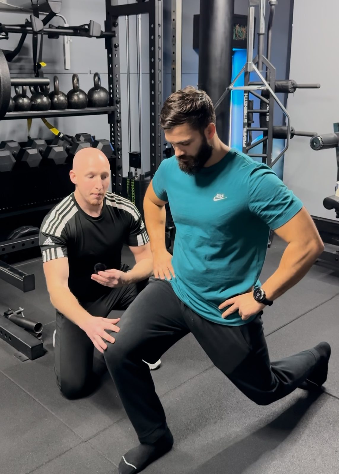 Jack coaching a client through a lunge